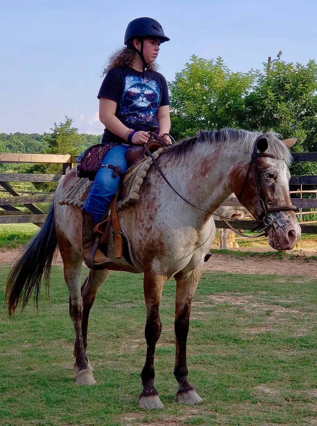 Rider on an Appaloosa horse wearing a Ukoala bag at the hip